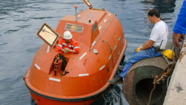 Oi London blog image of an enclosed lifeboat with two people